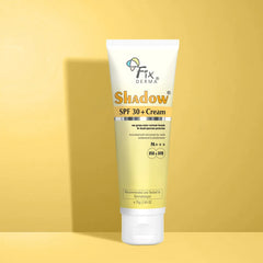 75gm Tube of Fixderma Shadow Sunscreen For Sensitive & Dry Skin SPF 30+ Cream, placed against a yellow background with a green leaf beside it